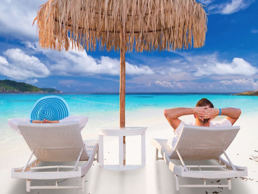 Couple louging in beach chairs on an island
